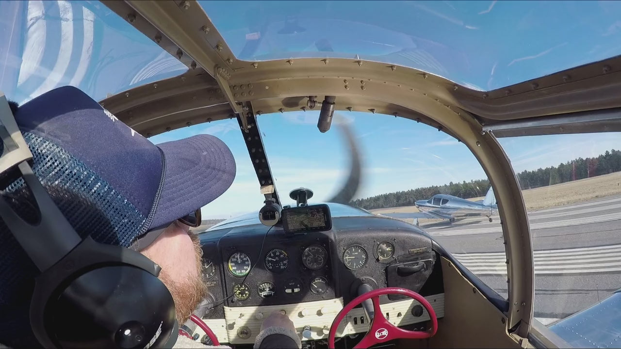 Load video: Aerial video of Glove Swift airplane flying over Massachusetts coast